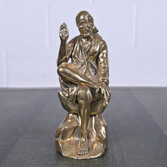 Brass Sai Baba Sitting on Rock 5 Inch