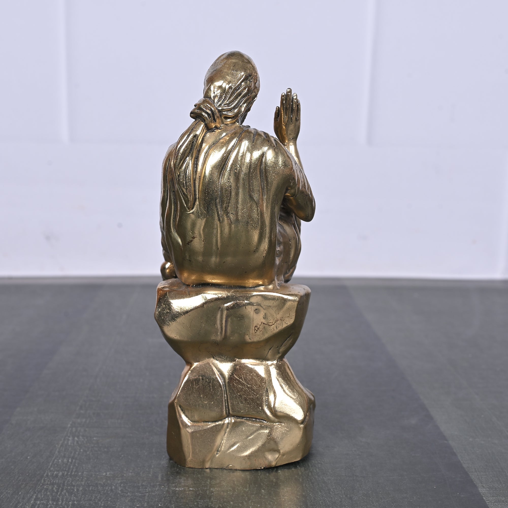 Brass Sai Baba Sitting on Rock 5 Inch